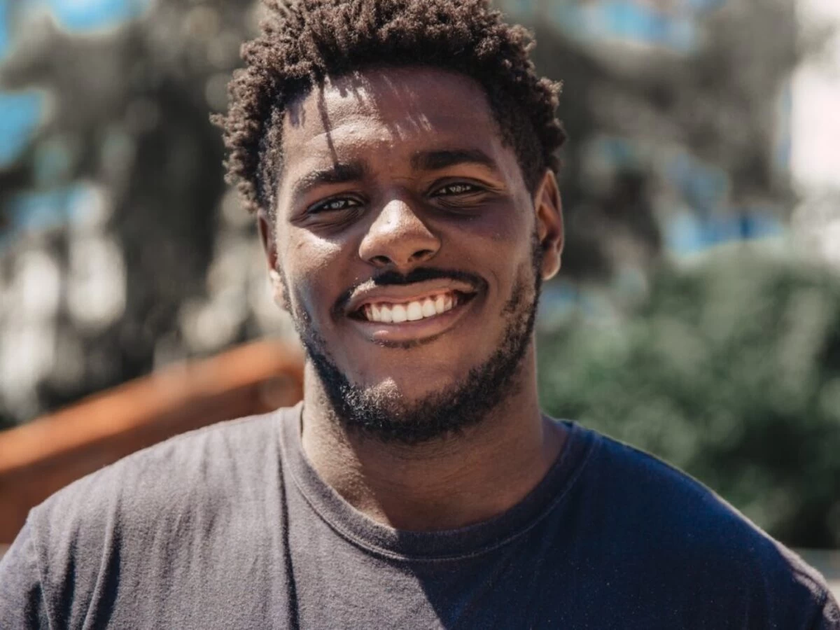selective focus of man smiling during daytime