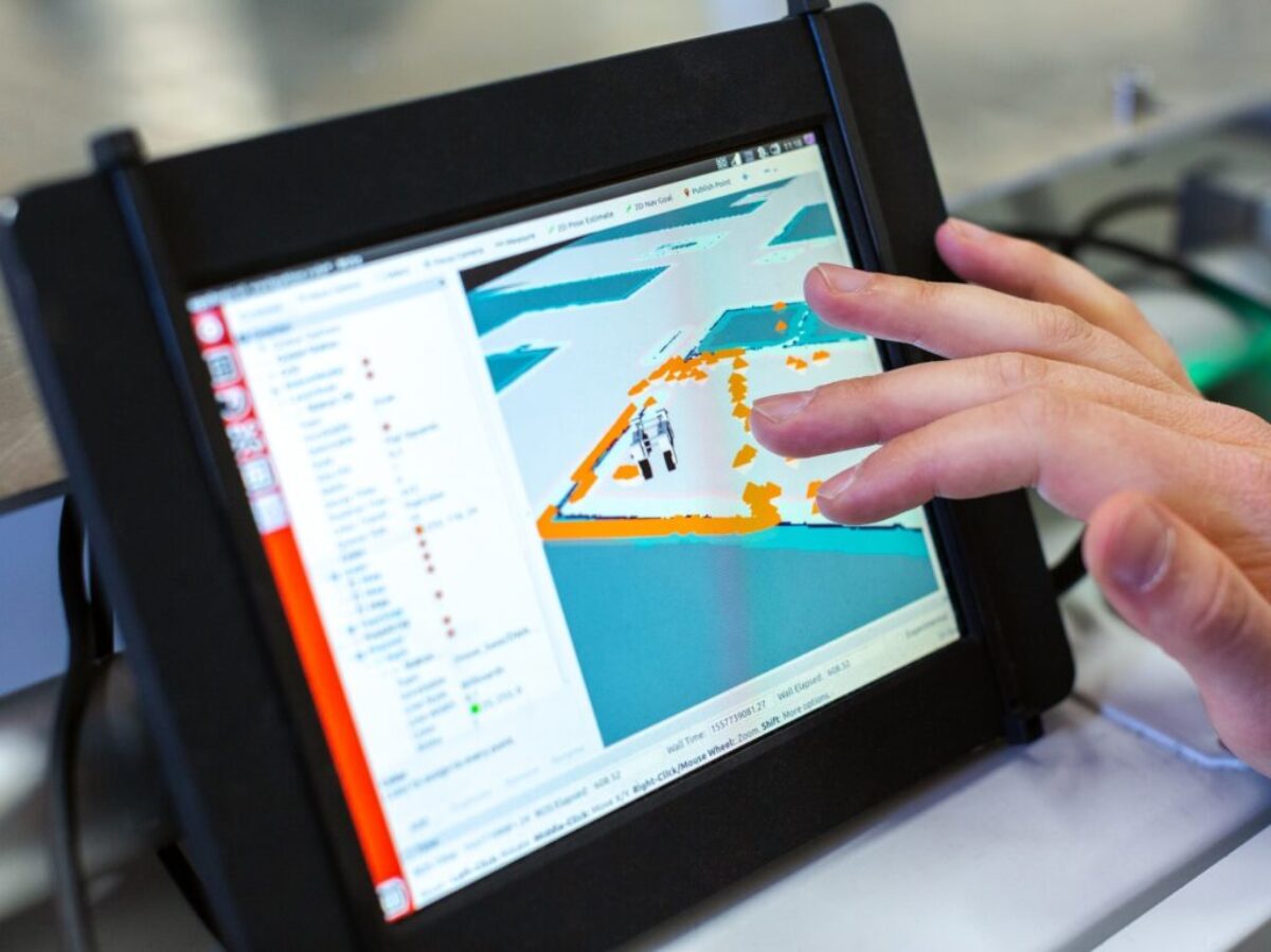 person holding black tablet computer