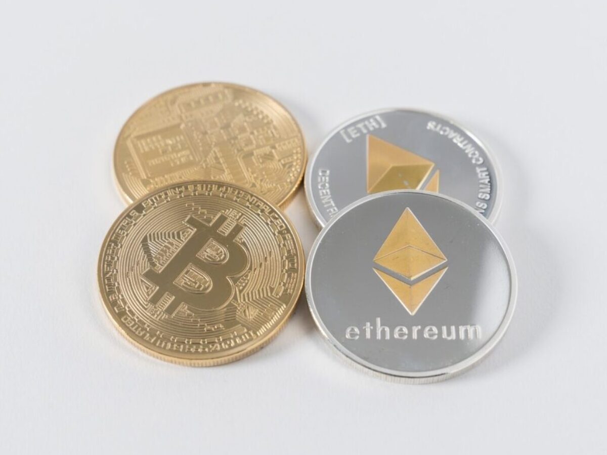 four round silver-colored and gold-colored Bitcoins