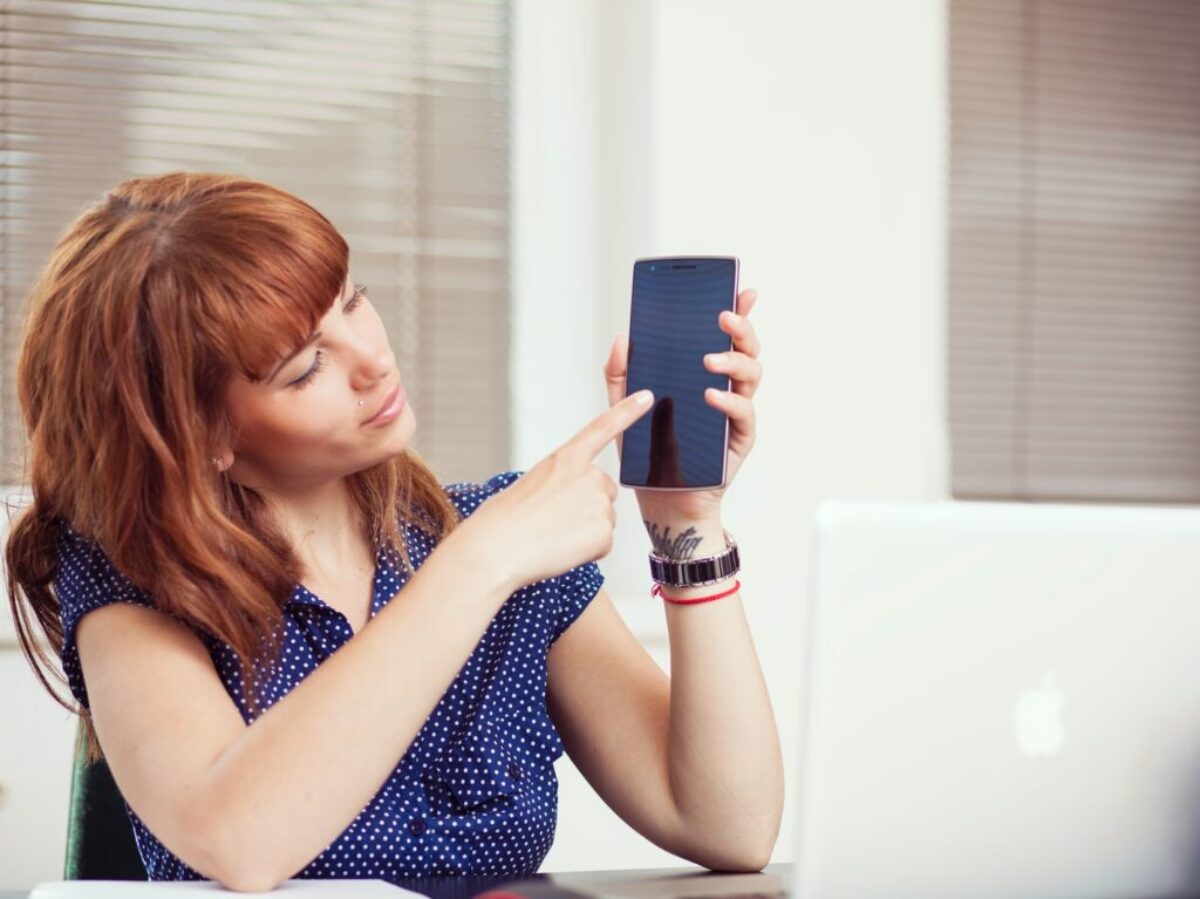 woman holding an Android smartphone