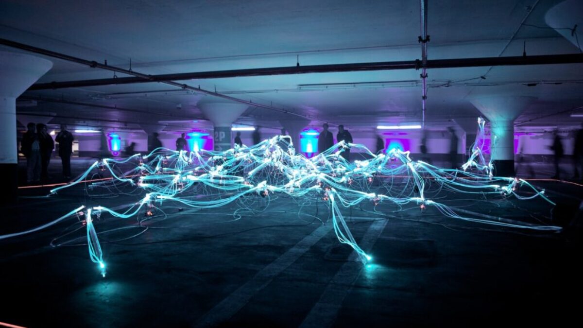 linked neon lights under white painted basement