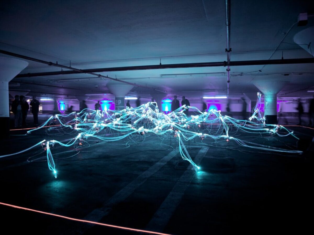 linked neon lights under white painted basement