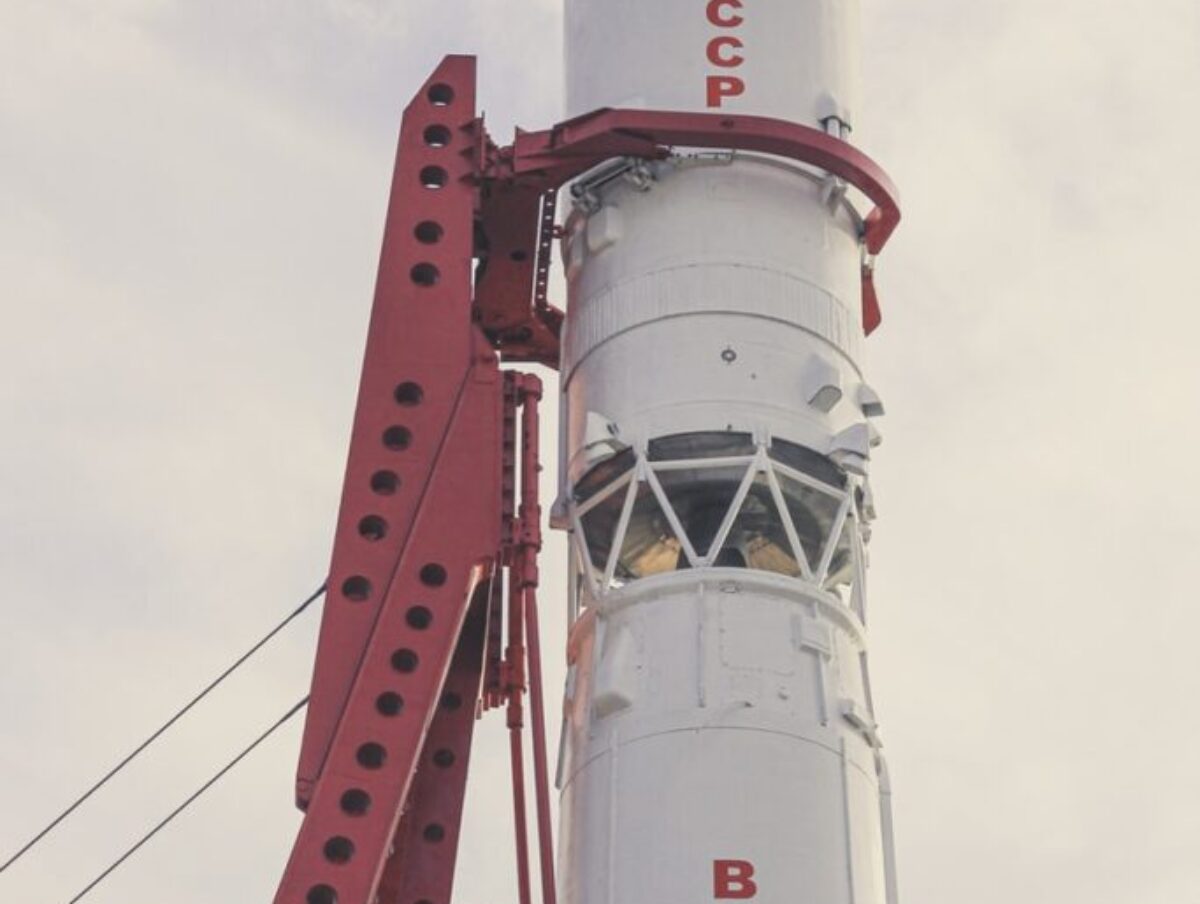 white and red lighthouse under white clouds during daytime