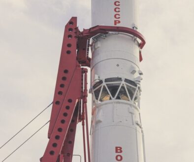 white and red lighthouse under white clouds during daytime