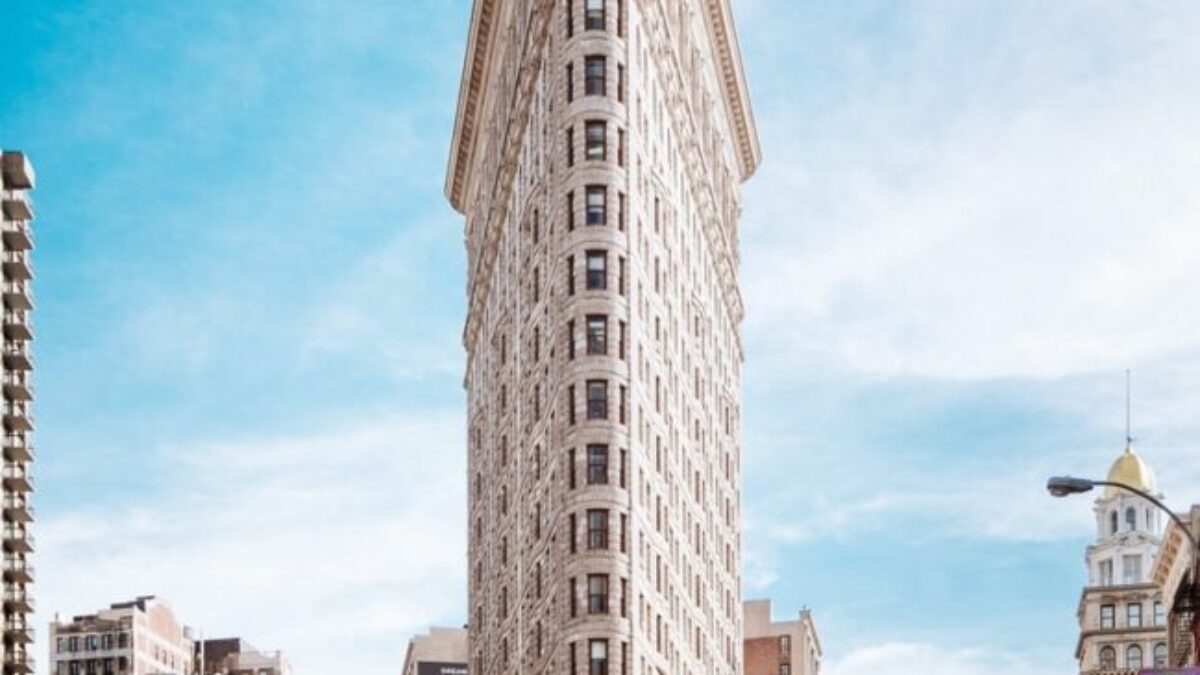 beige concrete building near cars