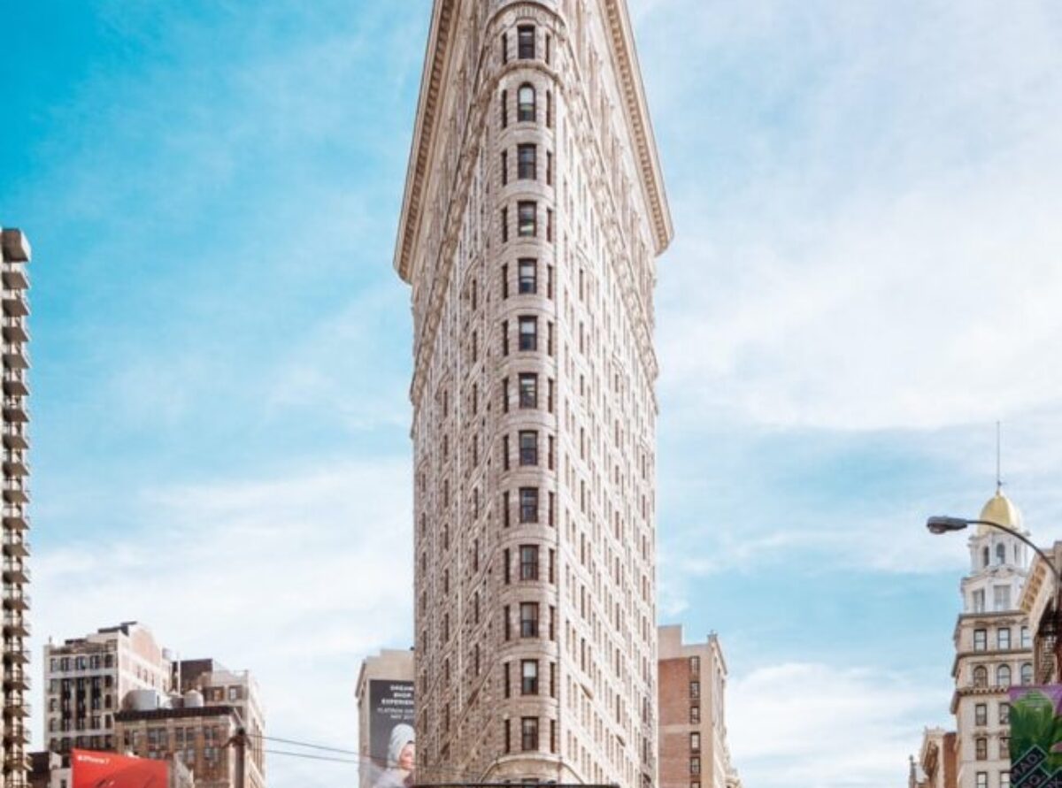 beige concrete building near cars