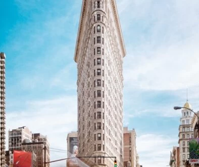 beige concrete building near cars