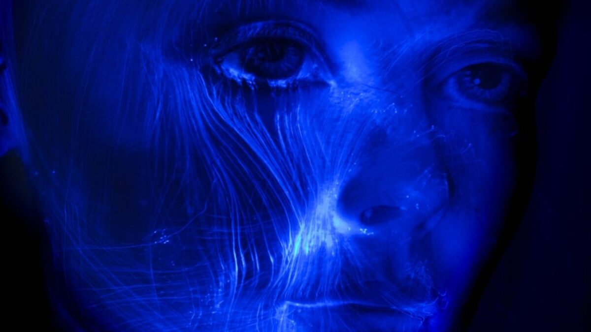 womans face with blue light
