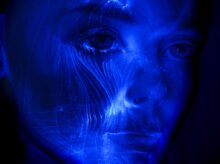 womans face with blue light
