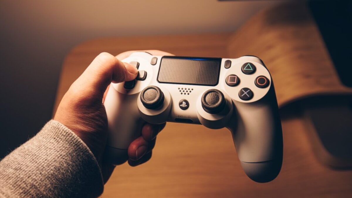 person holding black sony ps 4 controller