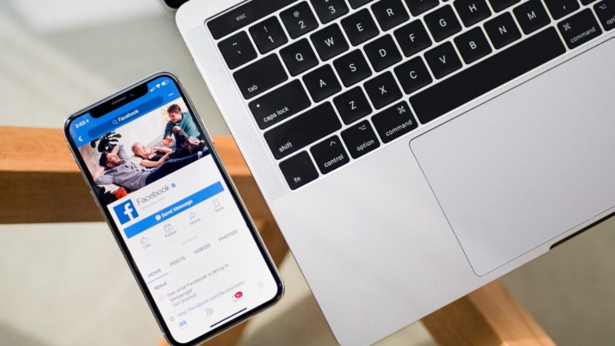 iPhone X beside MacBook