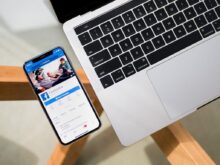 iPhone X beside MacBook
