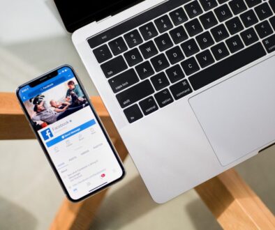 iPhone X beside MacBook