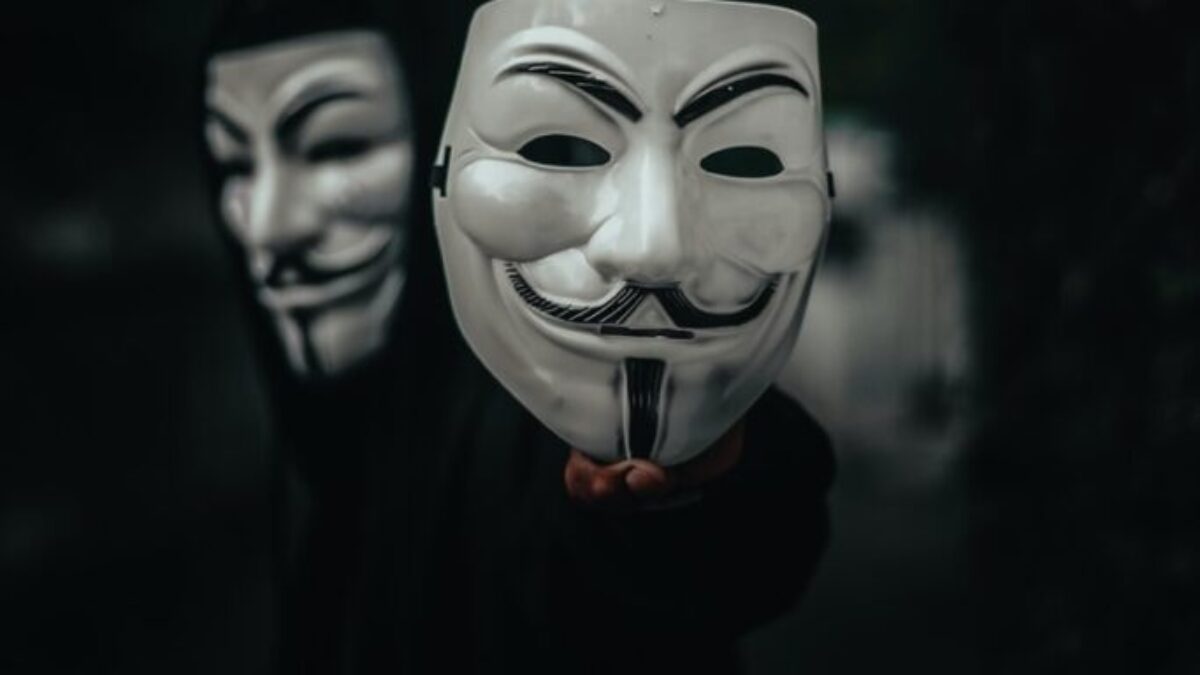 person in black and white mask