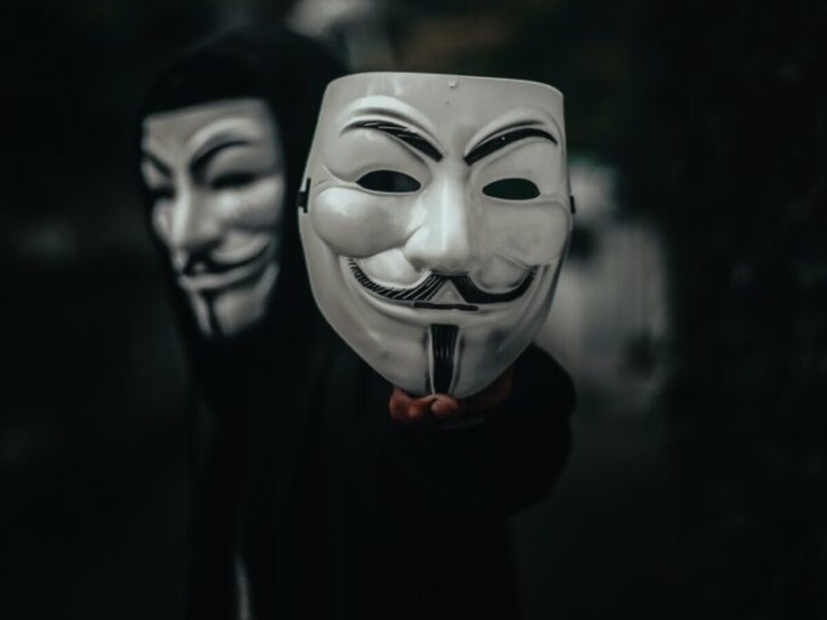 person in black and white mask