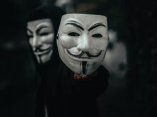 person in black and white mask
