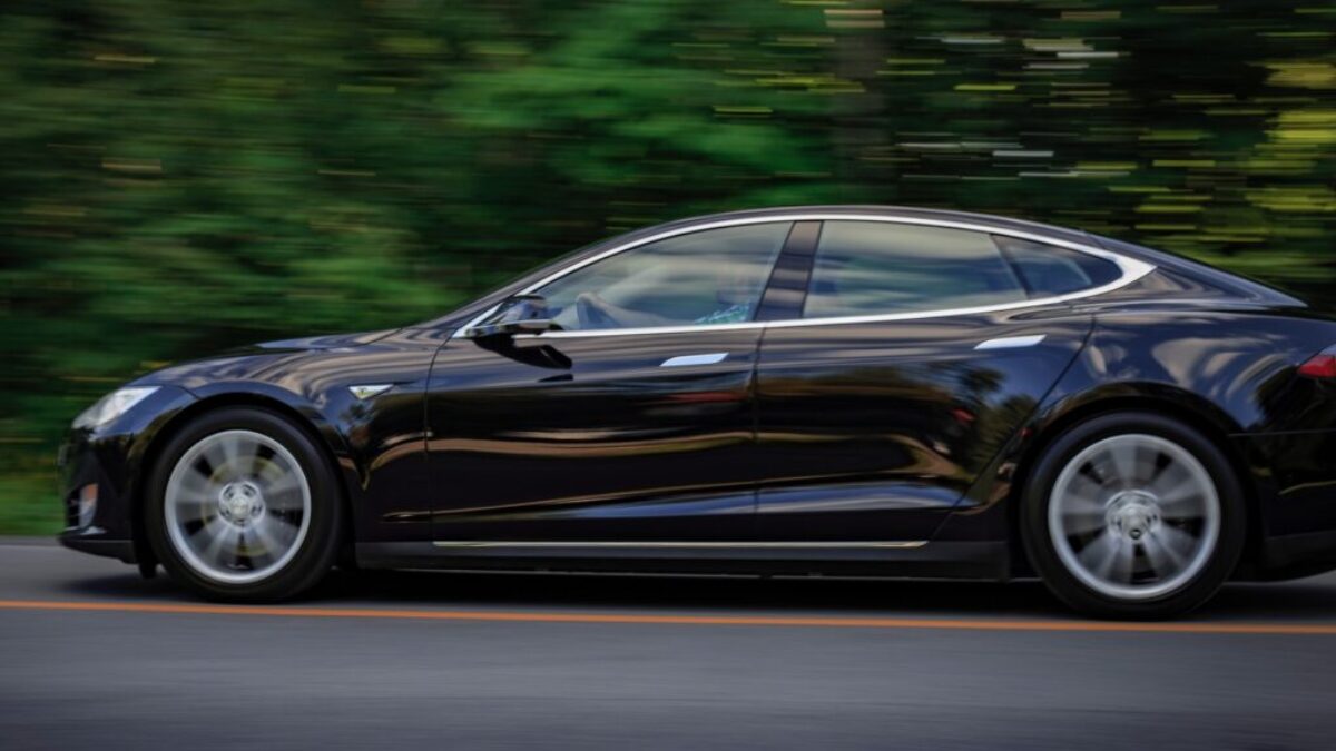 black sedan on gray concrete road