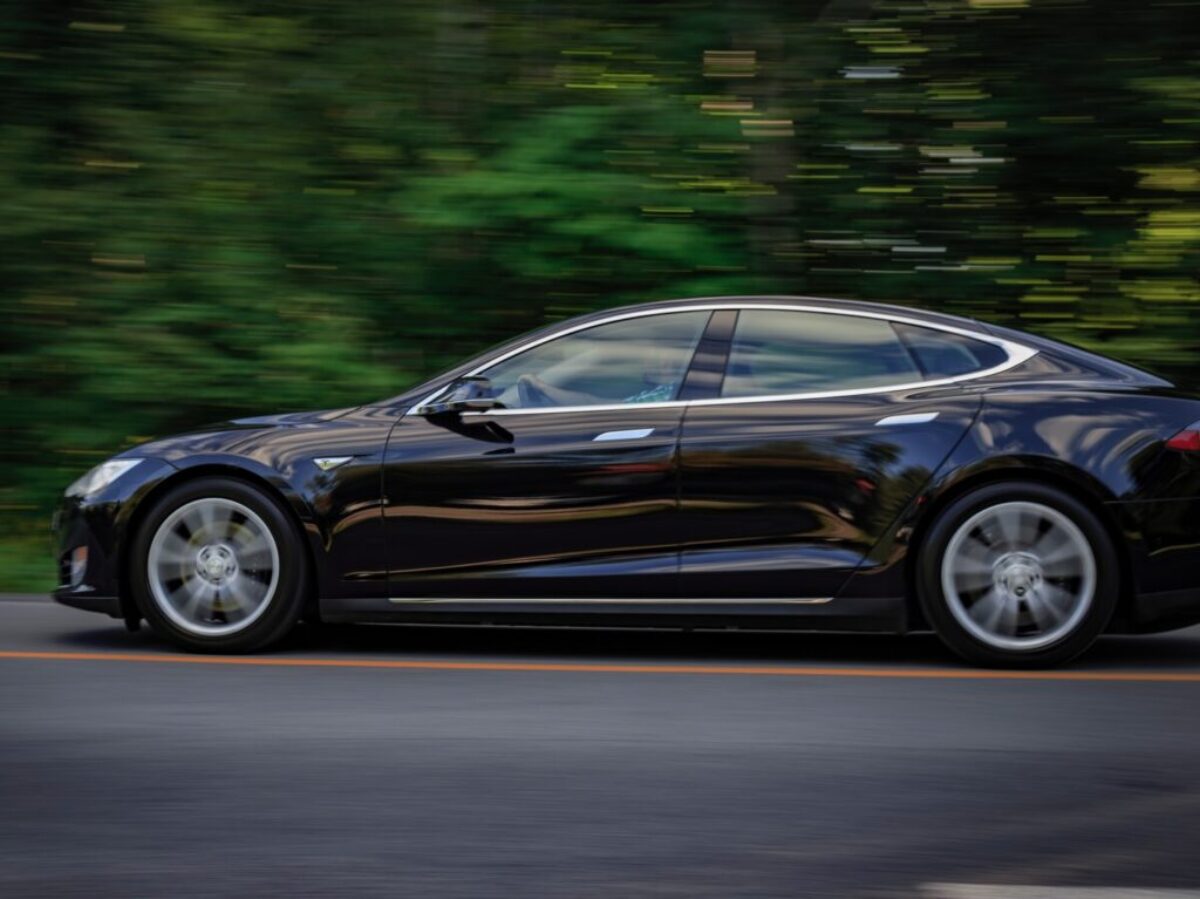 black sedan on gray concrete road