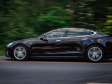 black sedan on gray concrete road