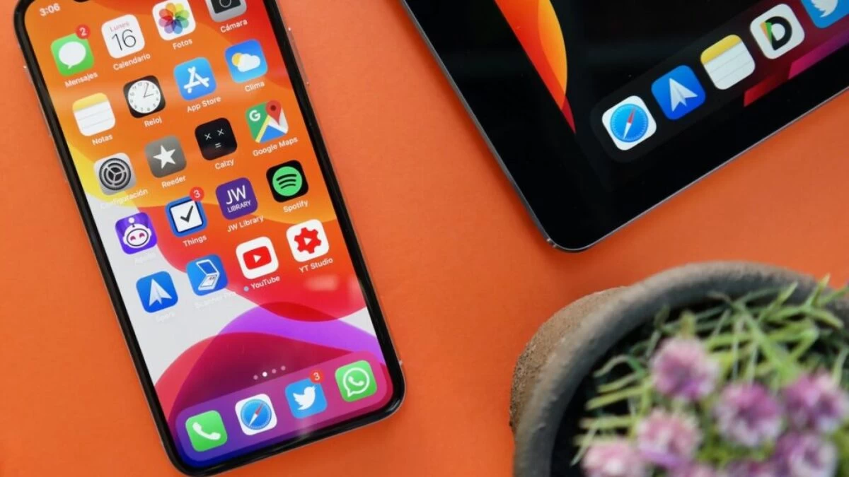 red iphone 5 c on white table