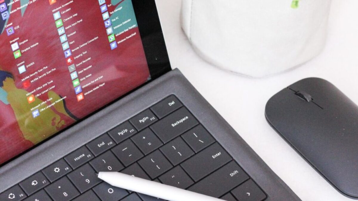 black laptop computer beside black wireless mouse