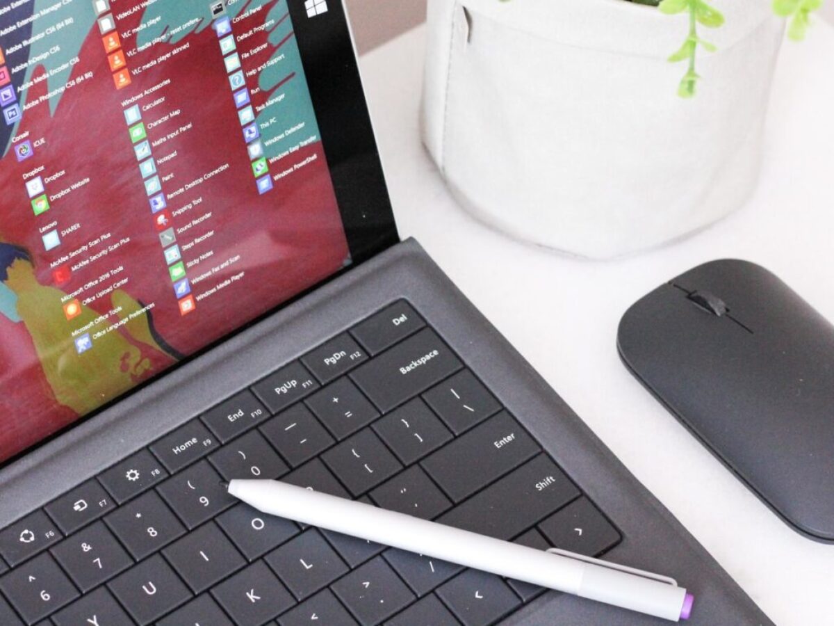 black laptop computer beside black wireless mouse