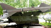 green and brown battle tank