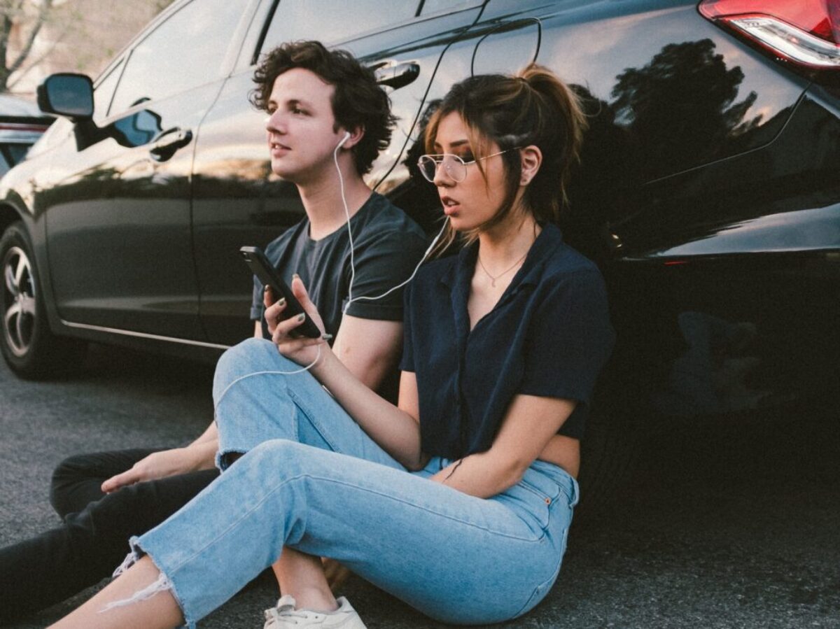 man and woman beside vehicle