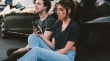 man and woman beside vehicle
