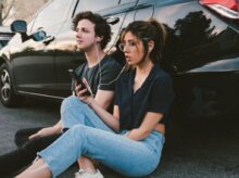 man and woman beside vehicle