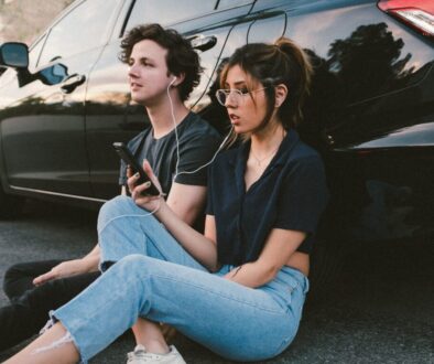 man and woman beside vehicle