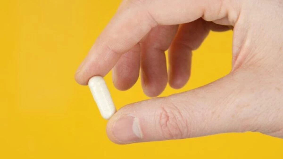 person holding white cigarette stick