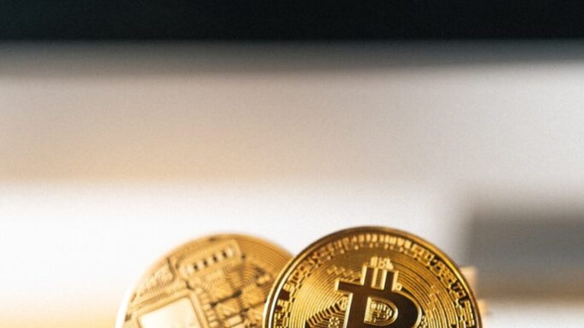gold round coin on white surface