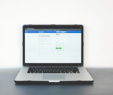 shallow focus photo of gray laptop computer on black surface