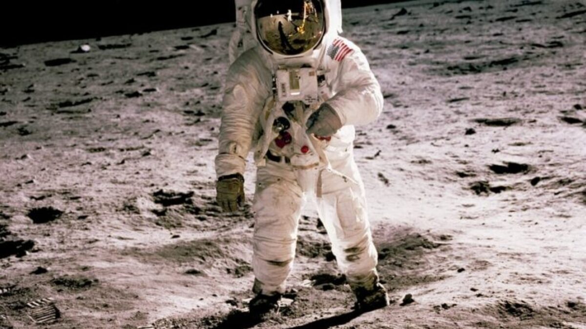 astronaut standing on gray sand