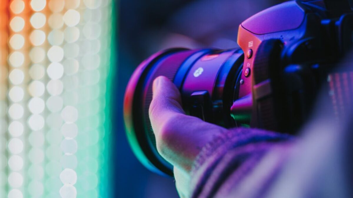 person holding DSLR camera