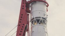 white and red lighthouse under white clouds during daytime