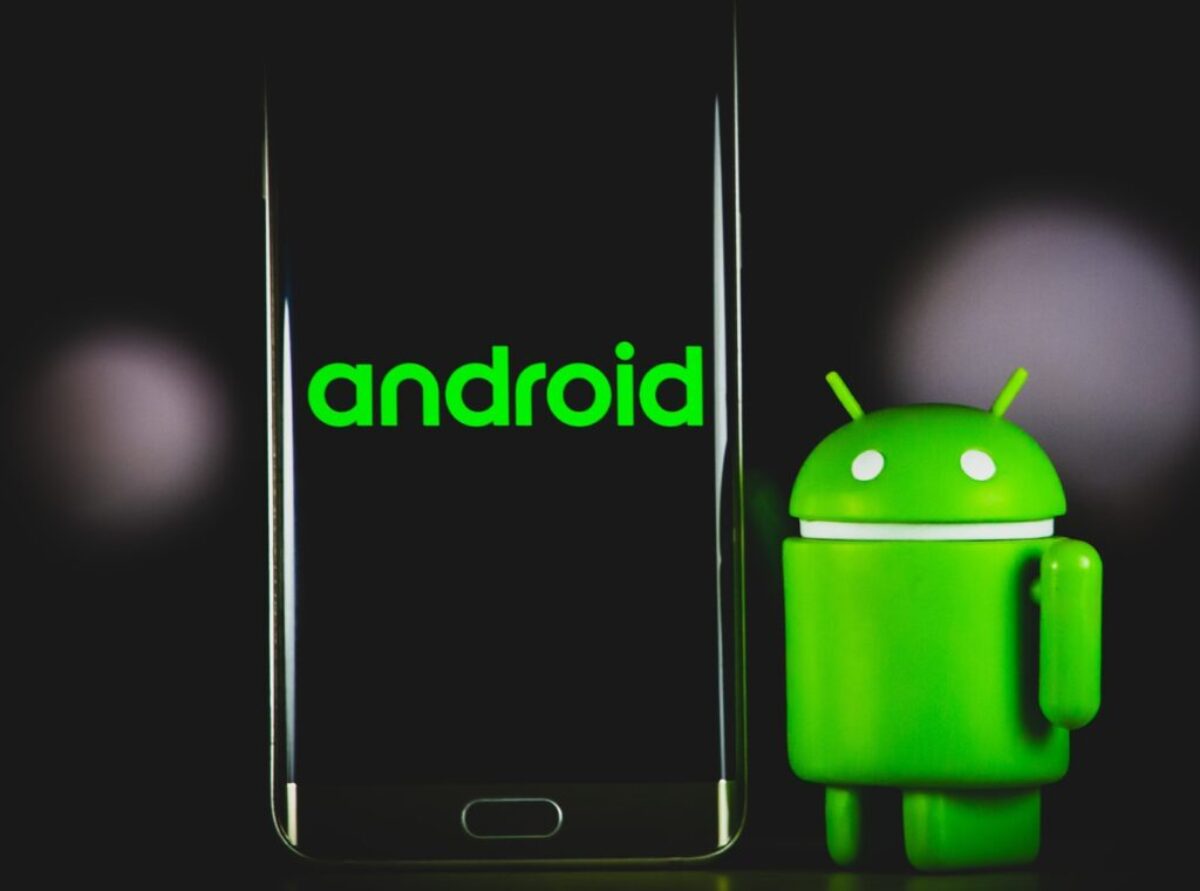 green frog iphone case beside black samsung android smartphone
