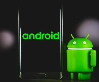 green frog iphone case beside black samsung android smartphone