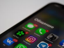 black iphone 4 on white surface