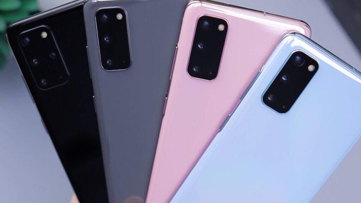 person holding pink and black iphone case