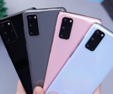 person holding pink and black iphone case