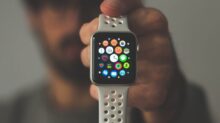 person holding silver aluminum case Apple Watch