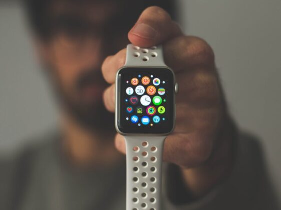 person holding silver aluminum case Apple Watch