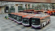 orange and white bus lot
