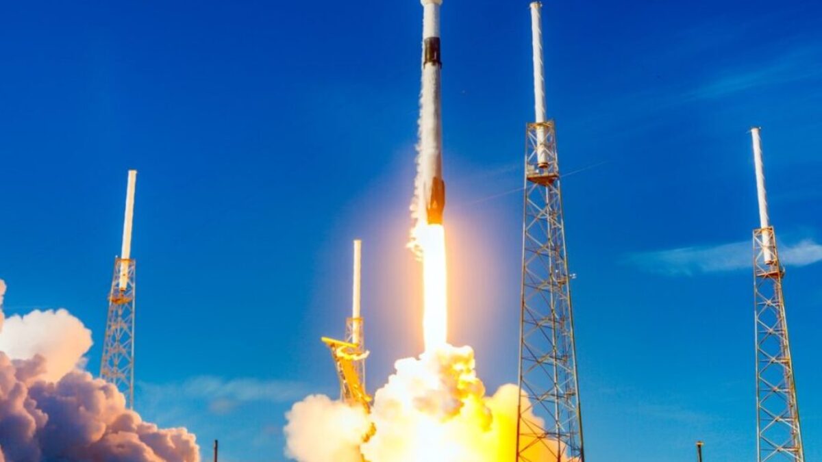 white and red space ship on blue sky during daytime