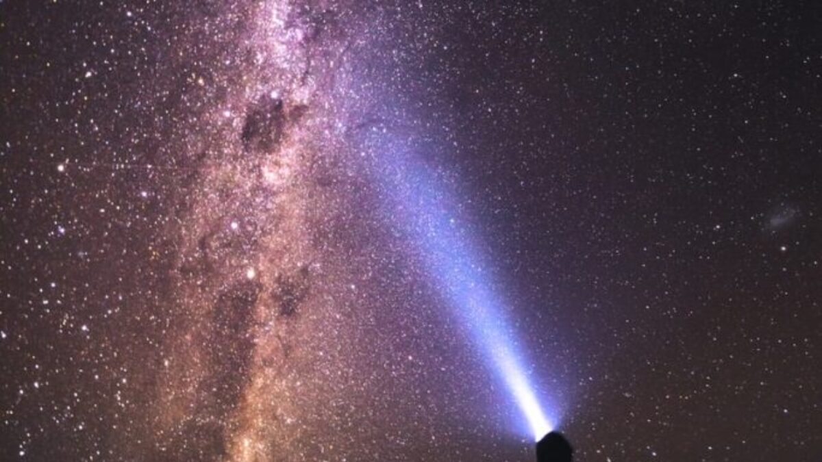 silhouette of man and woman under starry night