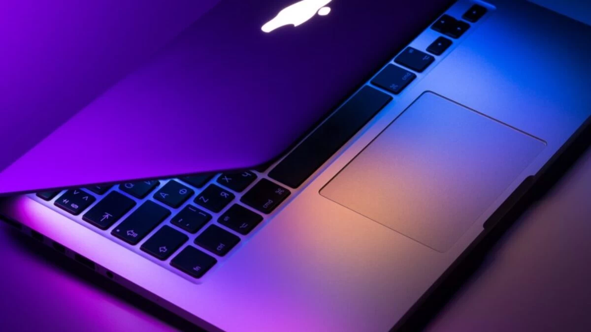 slightly opened silver MacBook