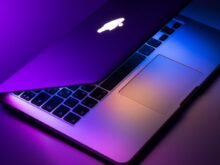 slightly opened silver MacBook