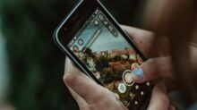 person holding black iphone 4